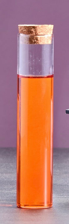 Huile culinaire bio aux crustacés dans une bouteille artisanale rouge, créée par le Chef Philippe Bellan