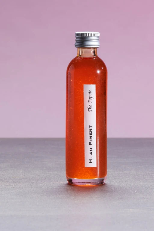 Organic Culinary Sunflower Oil Flavored with Chili Pepper and Herbs, in a bottle